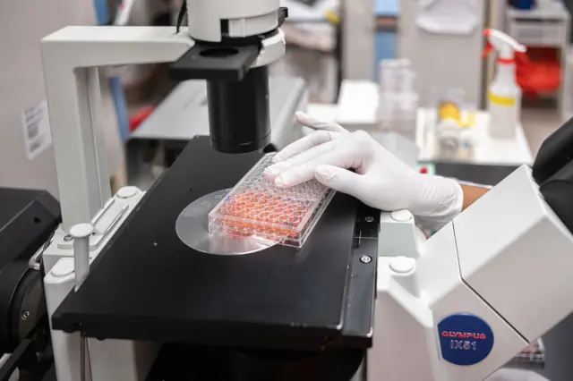 Raychel Lewis, cell culture technician, setting up equipment to test COVID-19 samples from recovered patients at Mirimus lab on 8 April, 2020 in Brooklyn, New York City