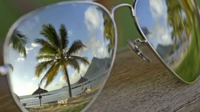 Beach reflected in sunglasses