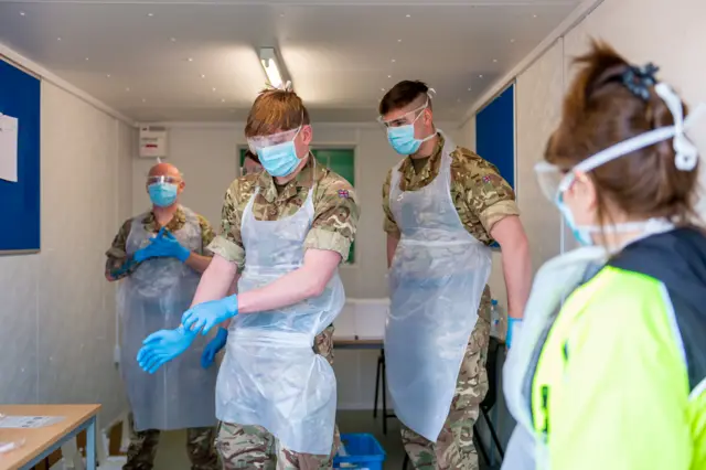 Soliders test NHS workers