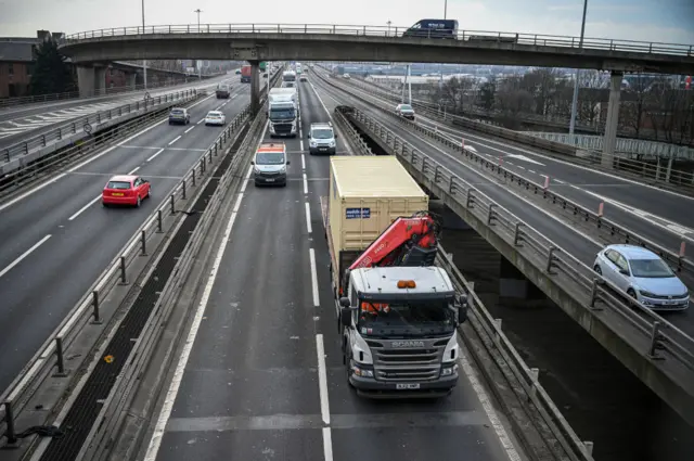 Traffic moves across Glasgow's Kingston Bridge as the country goes into lockdown on 24 March