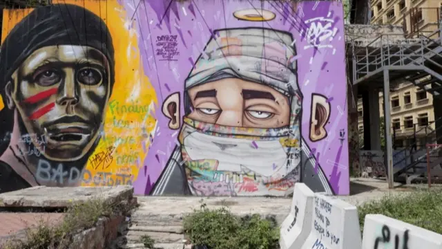 A graffiti of a man wearing a face mask in Beirut