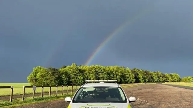 Rainbow and police car