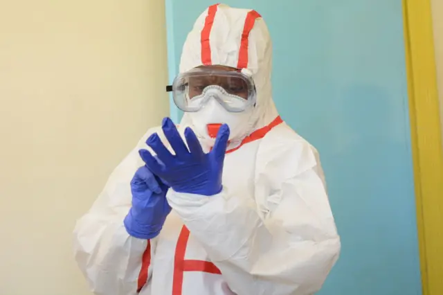 Kenyan health worker wearing protective gear