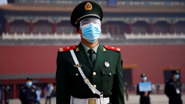 Chinese policeman wearing face mask