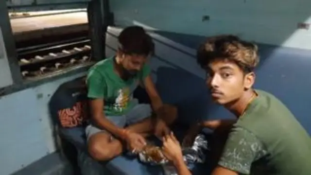 Workers eating on the train