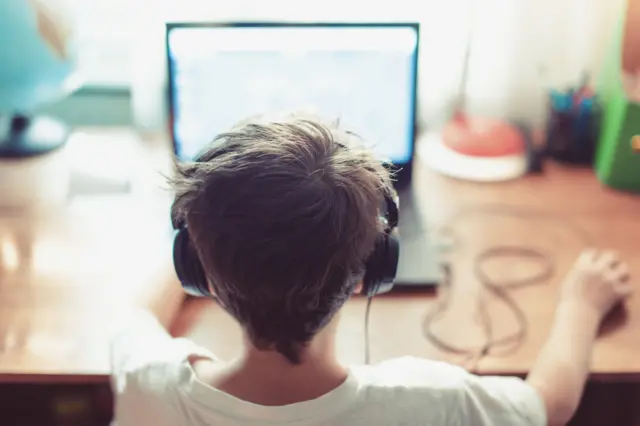 A boy at a computer