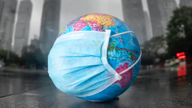 Globe with a face mask