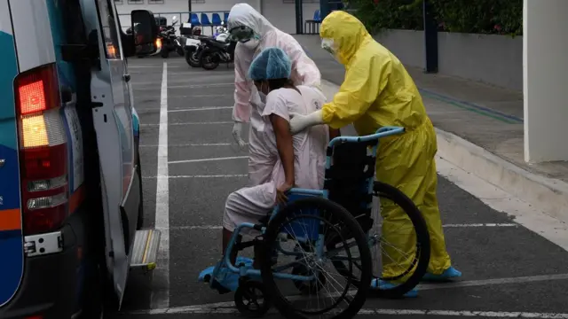 A recovered virus patient leaves hospital in El Salvador