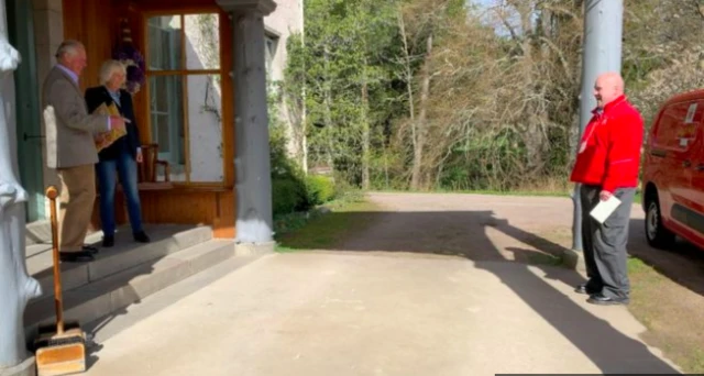 Royal couple and postal worker