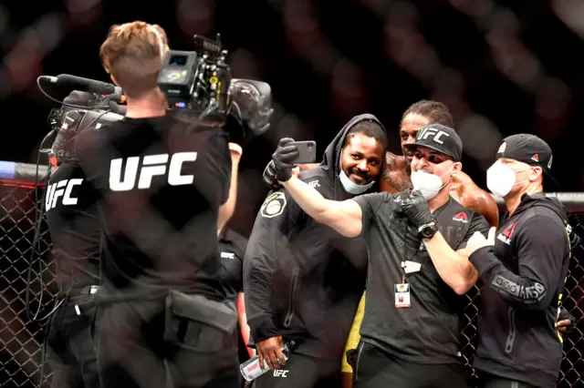 Ryan Spann of the United States celebrates with his team after defeating Sam Alvey