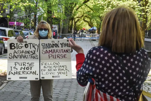 Two people protest against what they claim was bigotry again the Samaritan's Purse organization who ran a field hospital in Central Park across the street from Mt. Sinai Hospital on 4 May, 2020 on the Upper East Side neighborhood in New York City