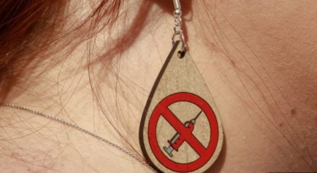 An anti-vaccine earring