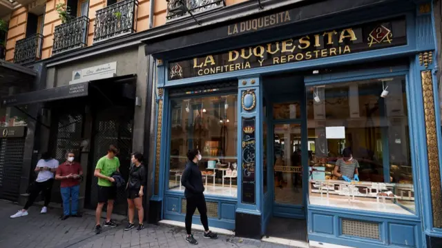 Madrid's La Duquesita patisserie with a queue outside during the coronavirus pandemic