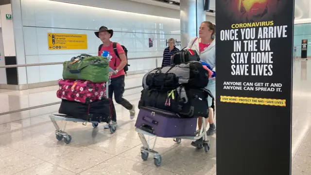 People in Terminal 2 arrivals at London Heathrow