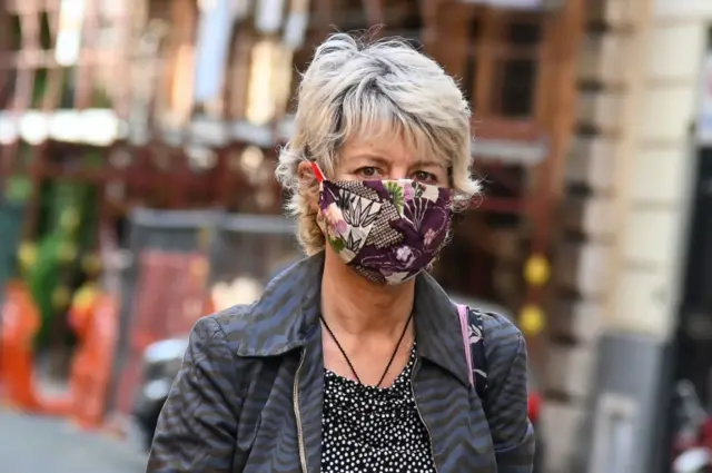 Woman wears a homemade face mask in Rome