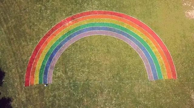 Rainbow on football pitch