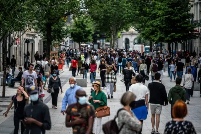 People walk on the streets of Lyon, central France. Photo: 11 May 2020