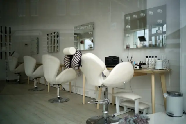 A view of a closed hair salon in Stockport during the pandemic lockdown and closure of shops, restaurants and businesses on 1 April 2020 in Stockport, United Kingdom