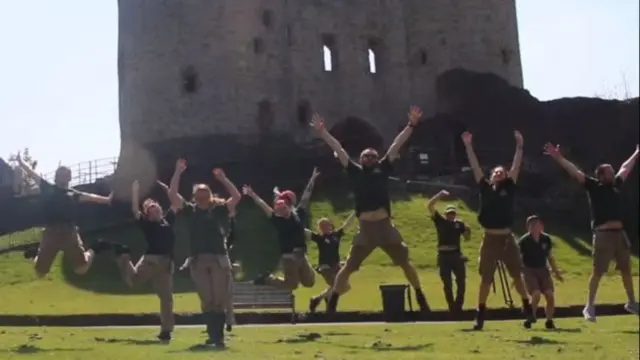 Staff at Dudley Zoo jumping jubilantly