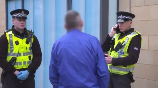 Police officers wearing gloves