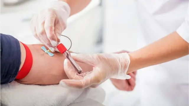 A person donating blood