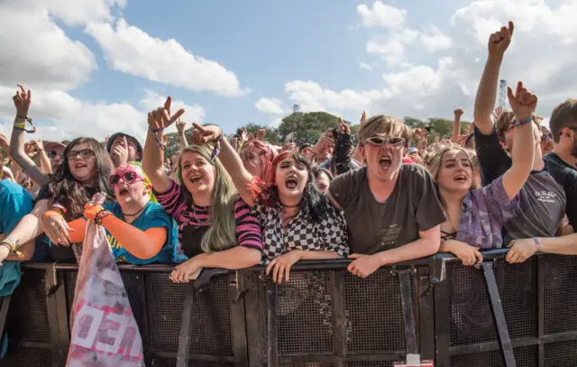 Music fans in front of the main stage at Leeds Festival in 2019