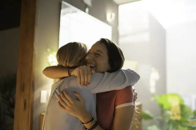 sisters hugging