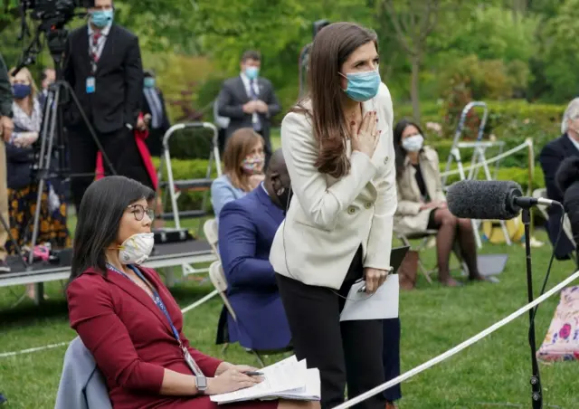 CNN White House correspondent Kaitlan Collins (R) tries to ask her question of US President Donald Trump after he called on her after an exchange with CBS News correspondent Weijia Jiang (L) during a coronavirus disease outbreak response briefing at the White House in Washington, US, on 11 May 2020