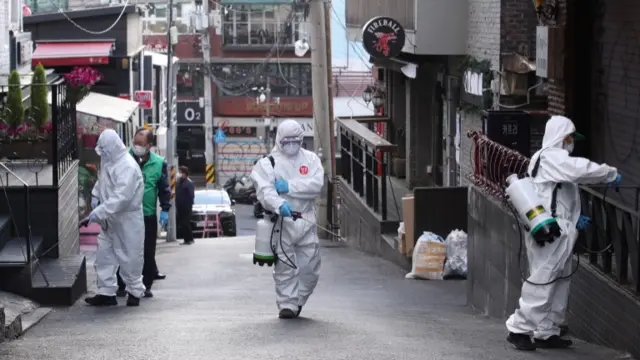 Workers disinfecting Seoul streets