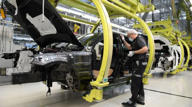 A worker assembling cars at the Mercedes-Benz factory in Sindelfingen, Germany