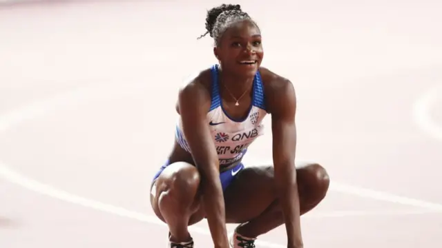 British sprinter Dina Asher-Smith celebrates winning gold in the women's 200 metres at the 2019 World Athletics Championships in Doha