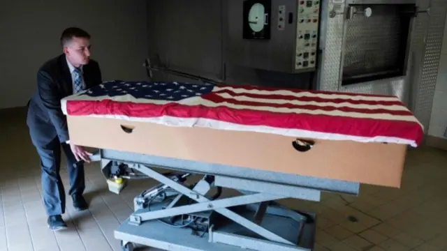 Coffin draped in US flag