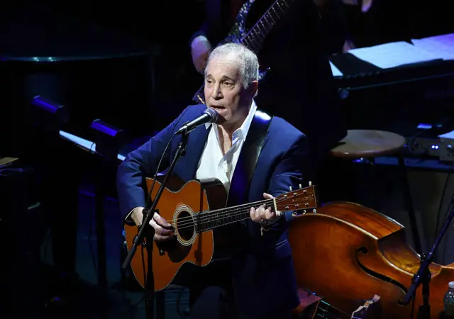 Paul Simon performs onstage in New York City