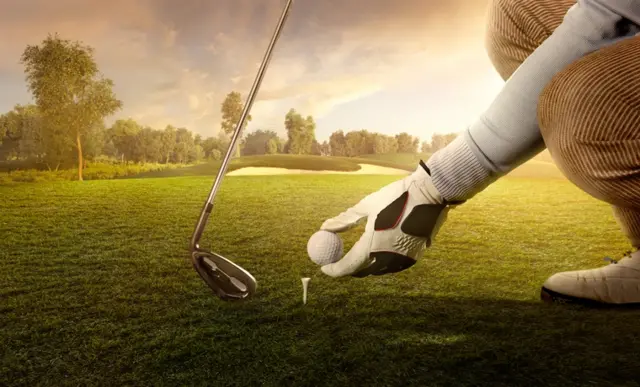 A golfer preparing for strike