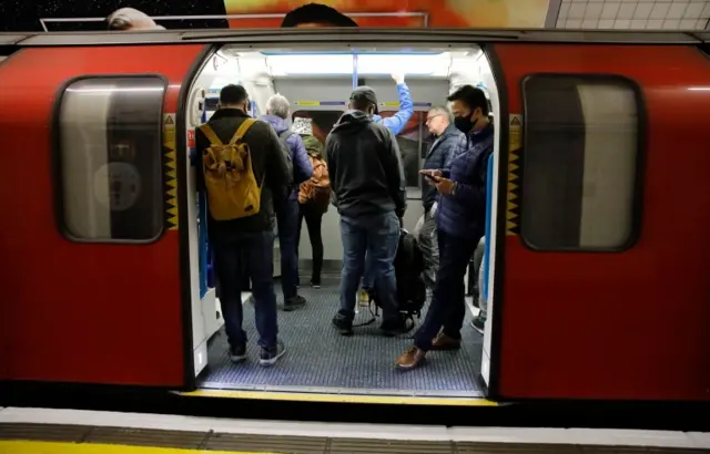 Commuters on London underground Victoria Line trains from King's Cross St Pancras towards central London