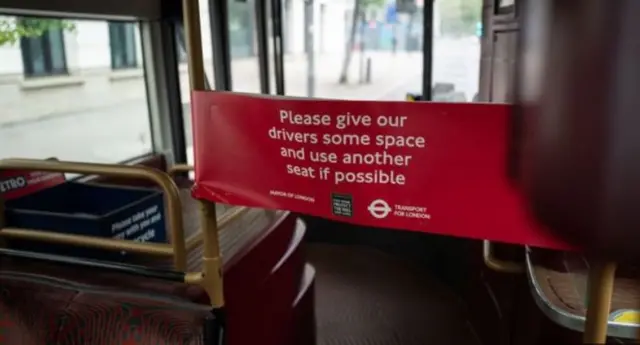 A sign on a London bus