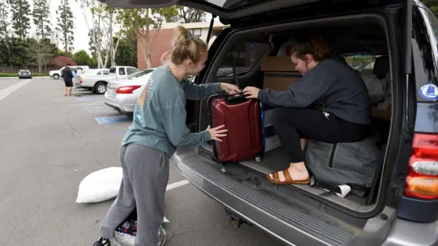 Students packing up to leave a California State University campus in March