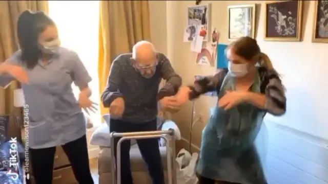 Jeanette McKenna dancing with a care home resident