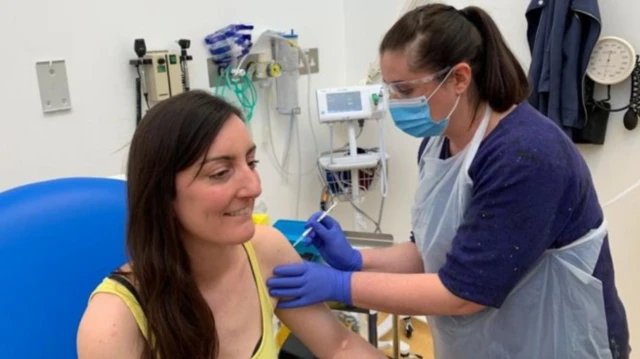 Elisa Granato being injected with a human coronavirus vaccine trial