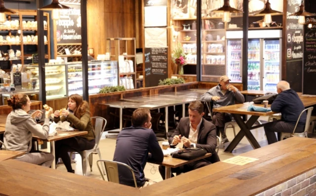 Customers dine in at newly re-opened cafe in Sydney