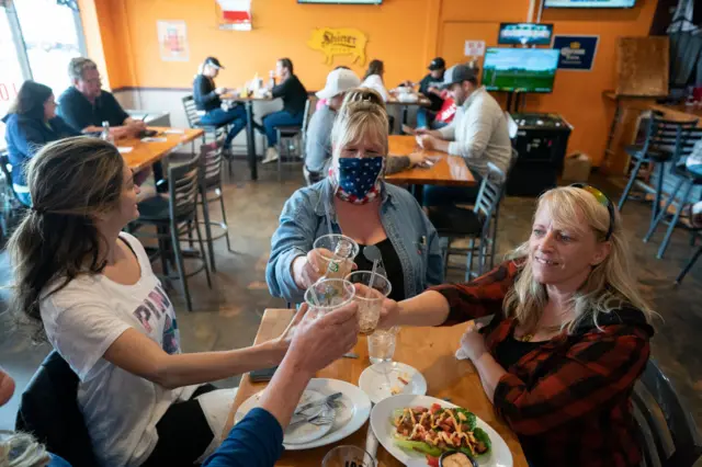 People at a bar in Hudson, Wisconsin, on the first day of reopening after the state's stay-at-home order was overturned