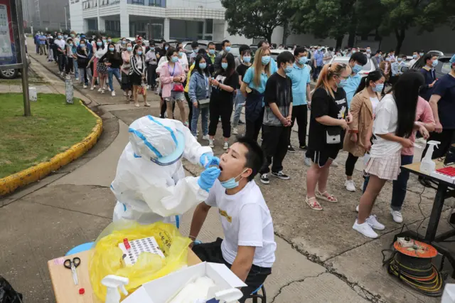 Wuhan residents line up to be tested