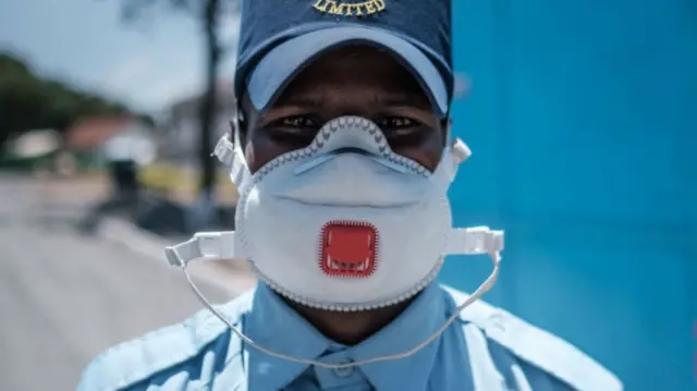 A security officer wearing a protective face mask at Kenyatta National Hospital in Nairobi, Kenya