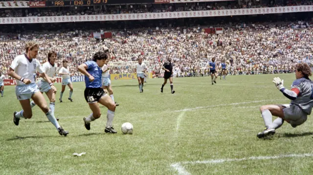 Diego Maradona scores against England in 1986