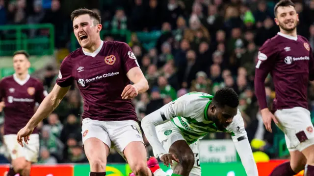 Hearts' John Souttar grimaces under pressure from Celtic's Odsonne Edouard