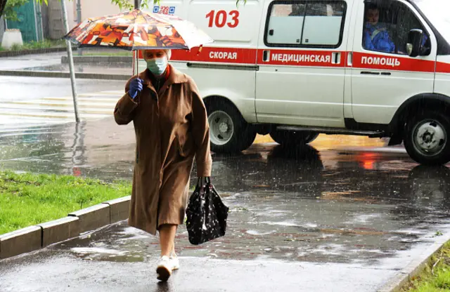 A woman walks on a Moscow street