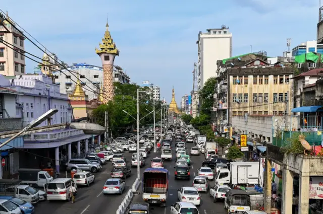 Motorists travel along a road in Yangon on May 14, 2020.