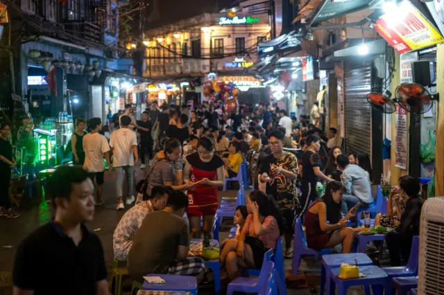 People hang out at Ta Hien Street which is well known as the beer street or beer corner on May 16, 2020 in Hanoi, Vietnam.