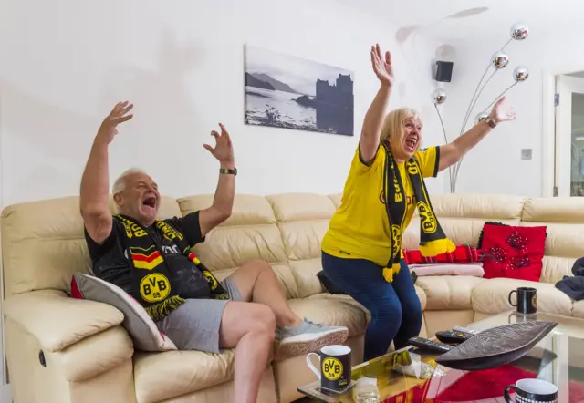 Borussia Dortmund superfans Ian and Alison Fraser enjoy watching their team on TV