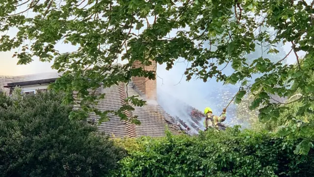 View of firefighter on roof